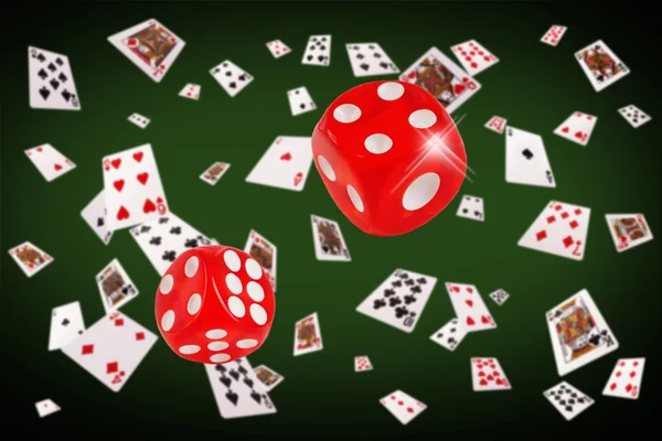 Playing cards and dice flying at the poker table — Stock Photo, Image