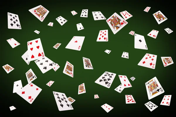 Playing cards flying at the poker table — Stock Photo, Image