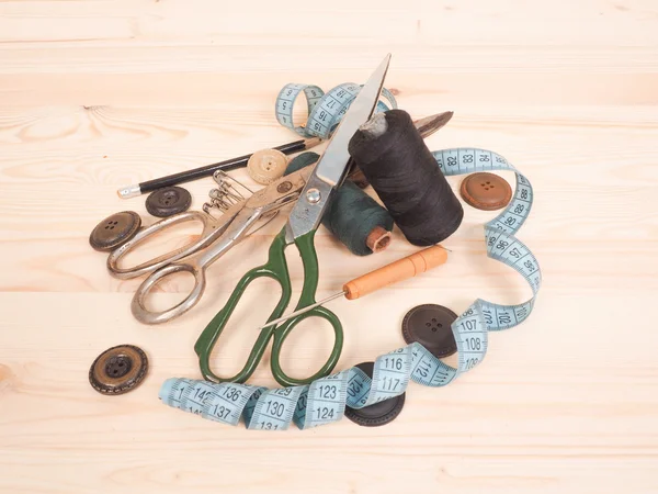 Sewing accessories in a wood background. sewing concept — Stock Photo, Image