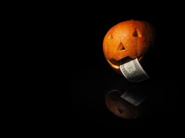Halloween dýně s dolarem na černém pozadí — Stock fotografie