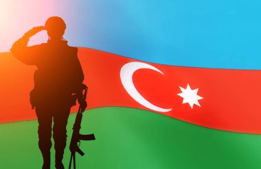 Silhouette Of A Solider Saluting Against the flag of Azerbaijan . Concept of national muslim holidays. Independence Day, Victory Day. clipart