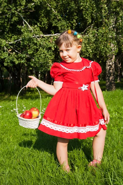 Girl holding an apple — Stock Photo, Image