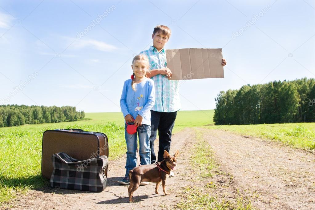 cute girl and boy with dog  on road