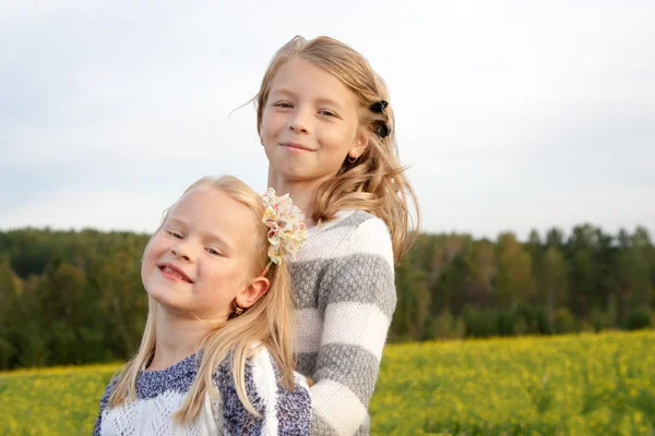 Portrait of two embracing cute little girls — Stock Photo, Image