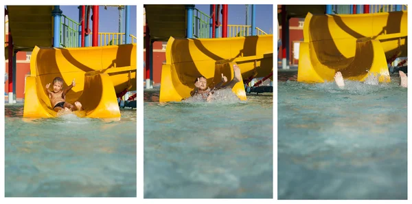 Ragazzo allegro rotola giù in acqua al parco acquatico — Foto Stock