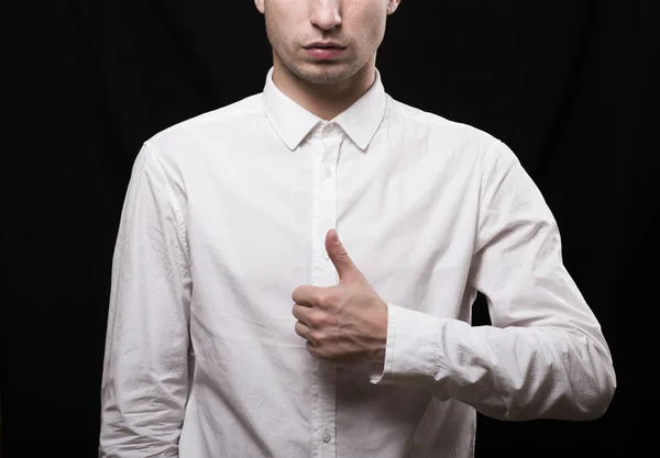 Portrait of a young man in a white shirt on a black background — Stock Photo, Image