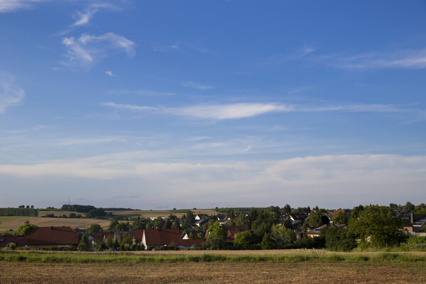 a beautiful village in the German province against the blue sky