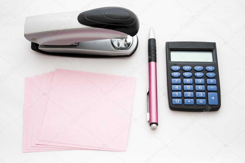 stapler, paper, pen and calculator