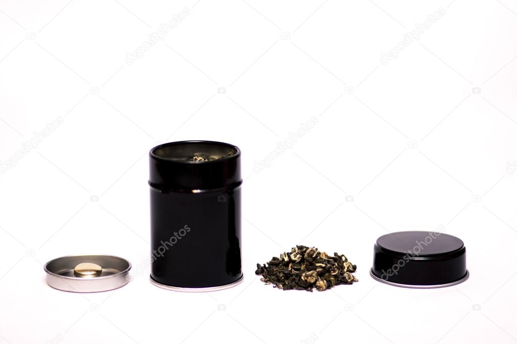 black tin box with lid and green tea leaves
