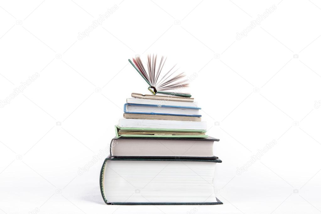 a small stack of books on a white background