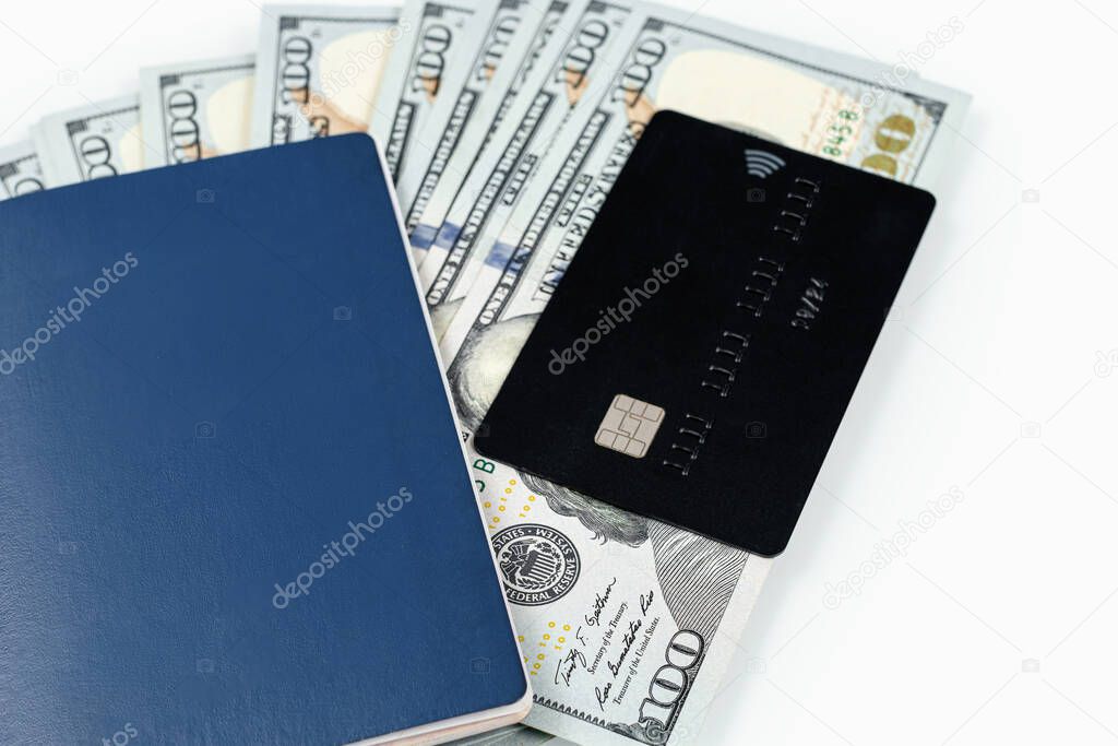 Money, credit card and passport isolated on a white background. Travel and vacation concept. Travel documents and dollars bills