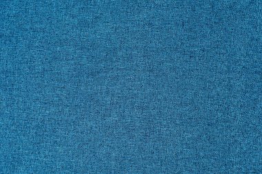 Koyu mavi, kumlu yüzey, üst manzara, pankart. Mavi kumaş iplik dokusunun arkaplanı