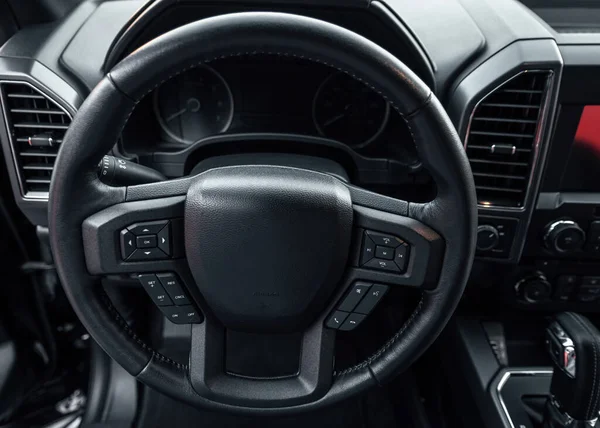 Car steering wheel. vehicle interior. Interior view of car with black salon.