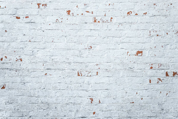 Old white seamless brick wall pattern background. Vintage texture of light brickwork