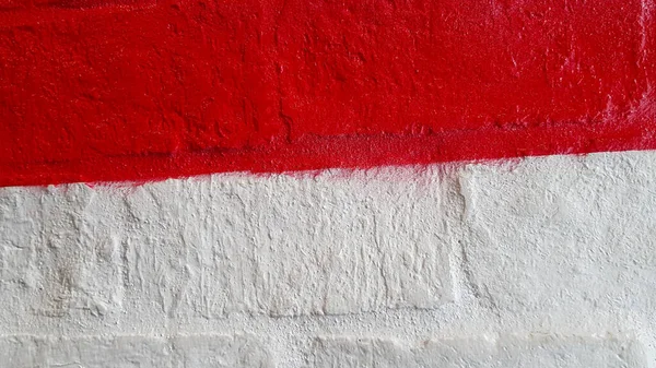 Red and white concrete wall for background or wallpaper. Exterior painted floor. Colorful brickwork and copy space concept.