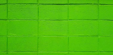 Arkaplan için yeşil tuğla ya da blok duvar. Pastel ve duvar kağıdının renkli boyası. 