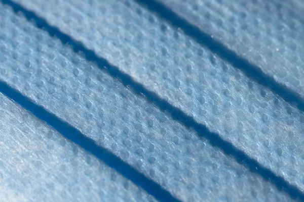 Mikroskopische Vergrößerung Der Oberfläche Einer Medizinischen Oder Chirurgischen Gesichtsmaske Blaue lizenzfreie Stockbilder