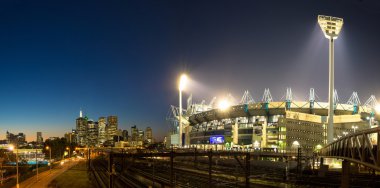 Melbourne, Avustralya - 5 Eylül 2014: The Melbourne manzarası ve gün batımında Melbourne Cricket Ground