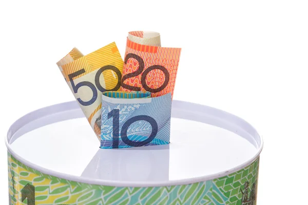 Billetes australianos metidos en una lata de dinero —  Fotos de Stock
