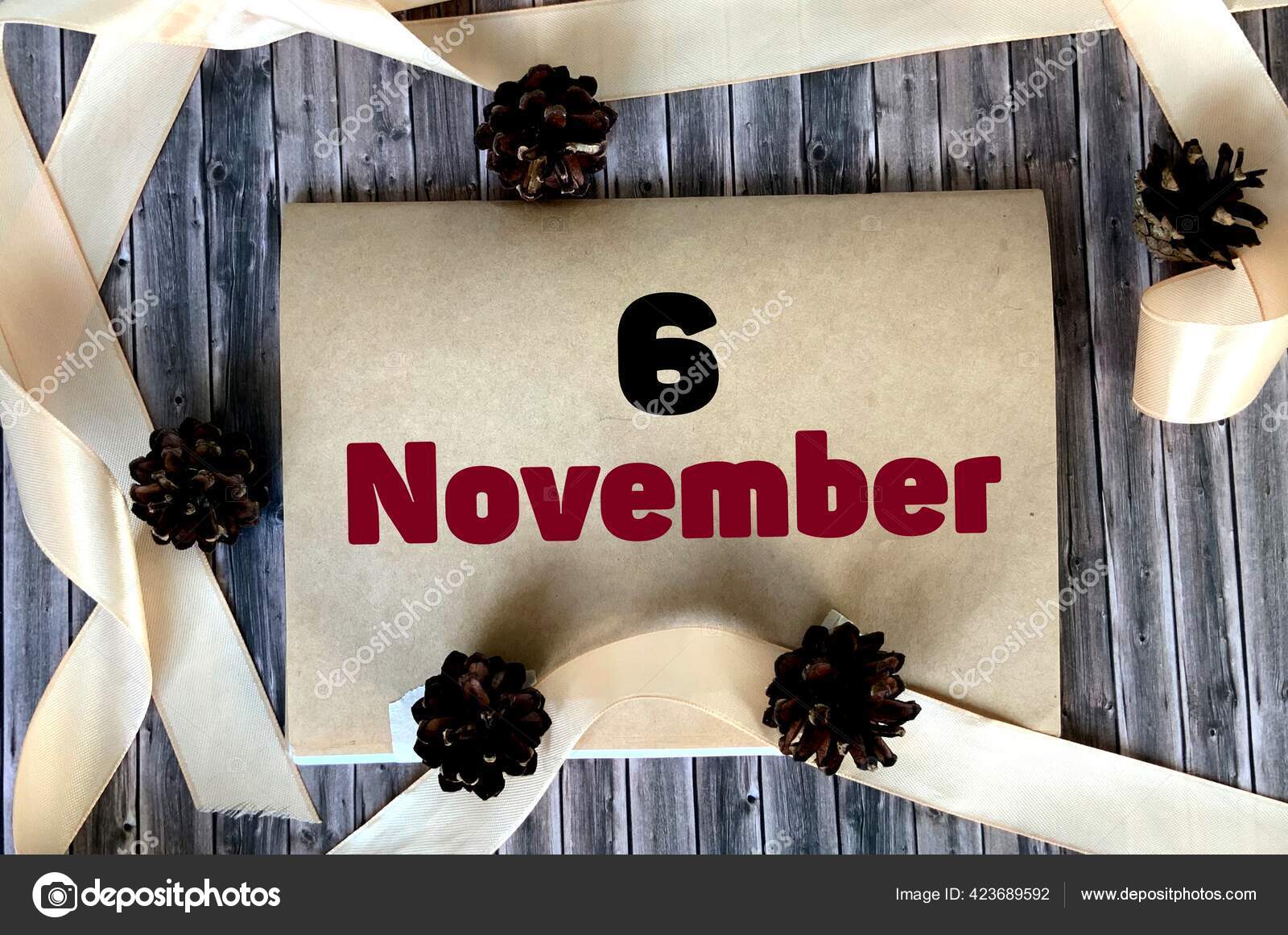 11月6日在木制背景的工艺用纸上11月日历 图库照片 C Veronikabogovich