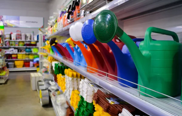 Close Plastic Multi Colored Watering Cans Shelves Store Goods Gardening — Stock Photo, Image