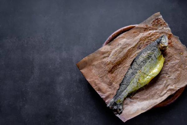 Trout Baked Whole Spices Baking Paper Wooden Board Black Background — Stock Photo, Image