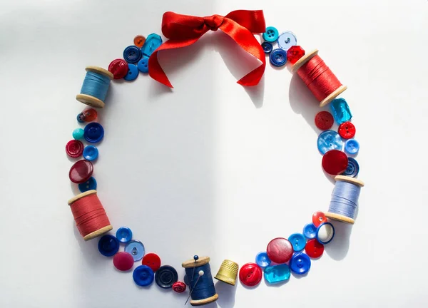 Wreath Made Buttons Threads Red Blue Colors Pins Bright Bow — Stock Photo, Image