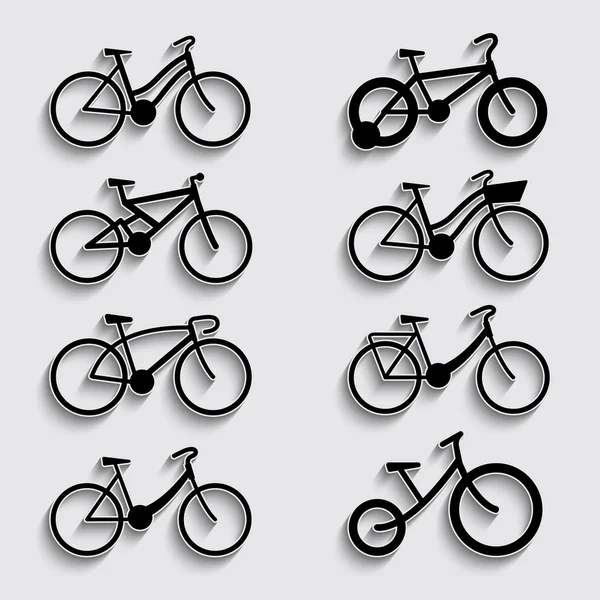 Icono de bicicleta conjunto con sombra sobre un fondo gris — Vector de stock