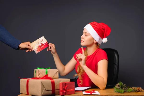 Elf Girl Receives Envelope Gift Certificate Sitting Table Gifts Pointing — Stock Photo, Image