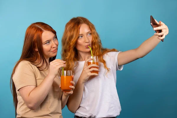 Two Red Haired Friends Take Selfie Modern Smartphone Holding Orange — Stock Photo, Image