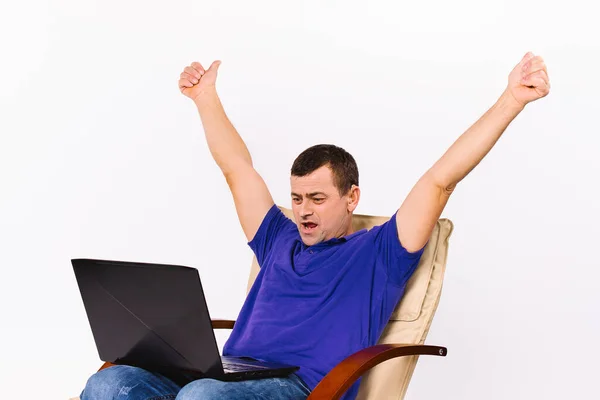A man with a laptop raised both hands up. Video communication using sign gestures. White background. — Foto de Stock