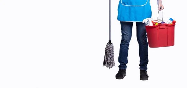 Banner, long format over white background with plenty space for your advertisement. Cropped photo of man body in apron with cleaning products in red bucket and wet mop. Only male feet wearing jeans — Stock Photo, Image