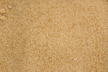 Esmer şeker arka planı. Esmer şeker dokusunu kapatın. Üst görünüm.