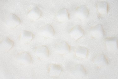 Küp şeker arka planı. Beyaz şeker dokusunu kapat. Üst görünüm.