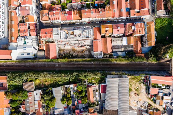 Aerial view of a small residential district in Lisbon outskirt along a railway, Marvila neighbourhood, Lisbon, Portugal.