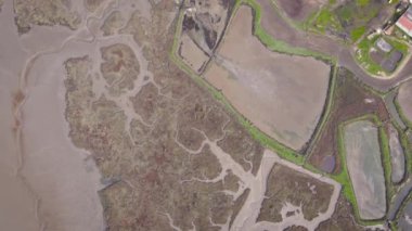 Aerial view of a beautiful lagoon along the Tagus river with green vegetation. Natural lagoon in Europe. Setubal, Portugal.
