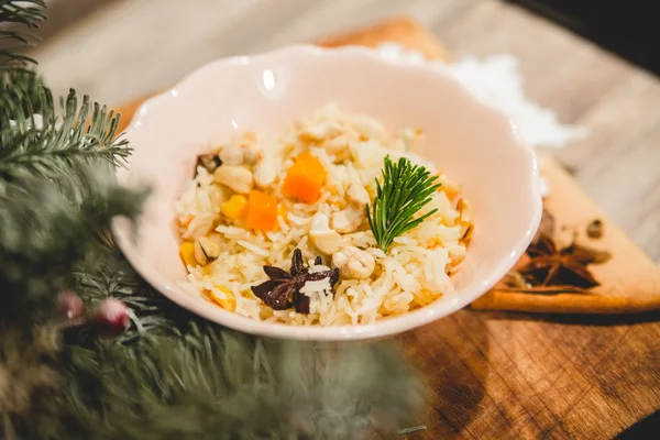 Thistle,dried fruit and rice on Christmas background — Stock Image Thistle,dried fruit and rice on Christmas background Royalty Free Stock Images
