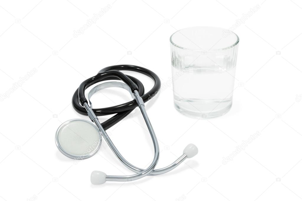 Stethoscope and a glass of water
