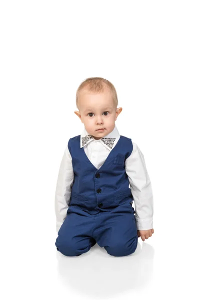 Portrait of boy sitting on knees — Stock Photo, Image