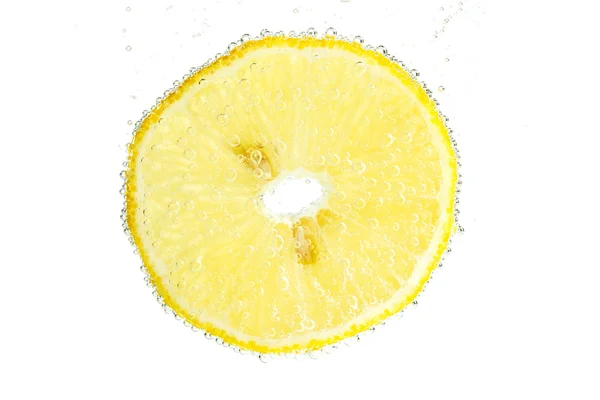 Slice of lemon with bubbles — Stock Photo, Image