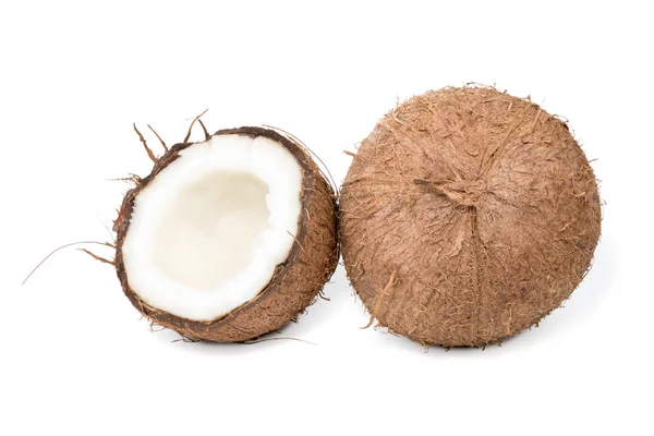 Ganze und halbe Kokosnuss — Stockfoto