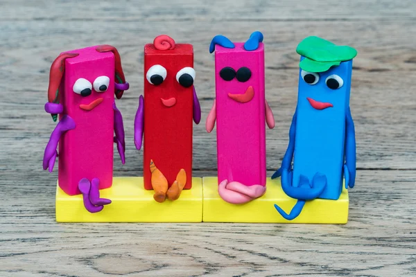 Four human figures from plasticine