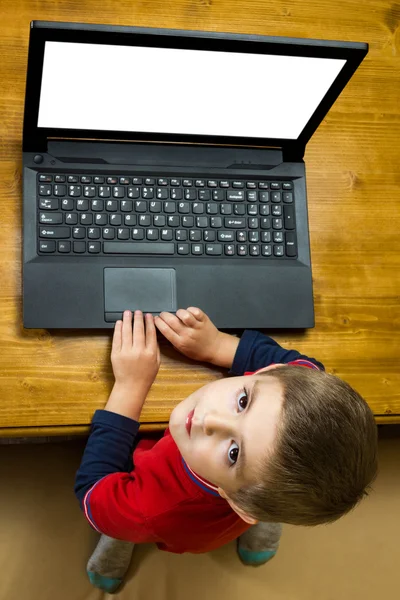 Boy working at a laptop — Stock Photo, Image