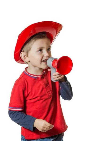 Χαριτωμένο μικρό αγόρι σε ένα κοστούμι πυροσβέστη — Φωτογραφία Αρχείου