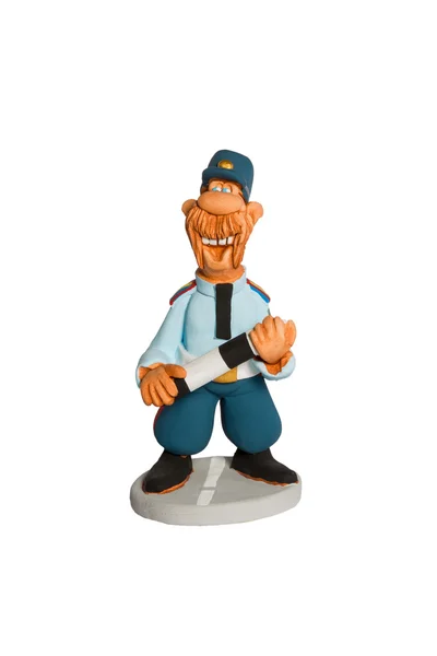 Statuetka policjanta z kijem na drodze — Zdjęcie stockowe