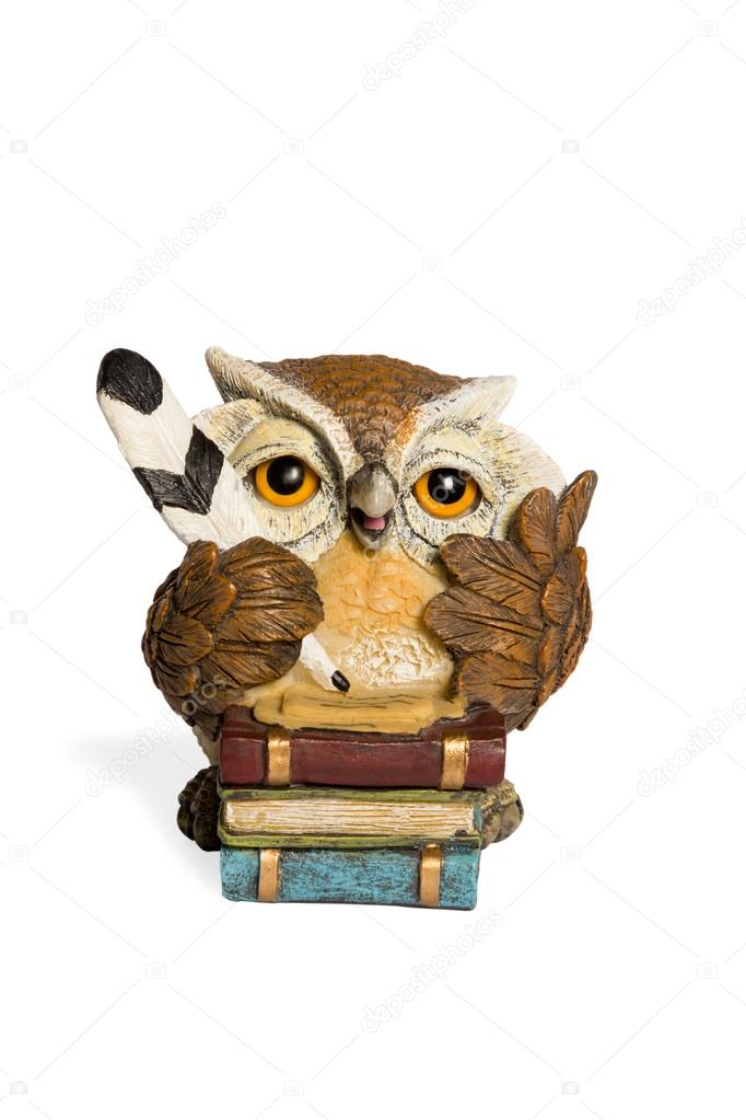 Statuette beige owl with feather and books