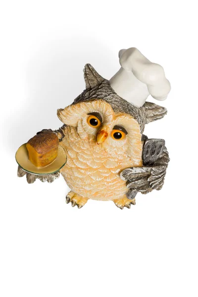 Owl figurine in nightcap with bread on a tray — Stock Photo, Image