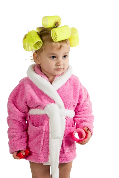 Little girl in a bathrobe and curlers — Stock Photo, Image