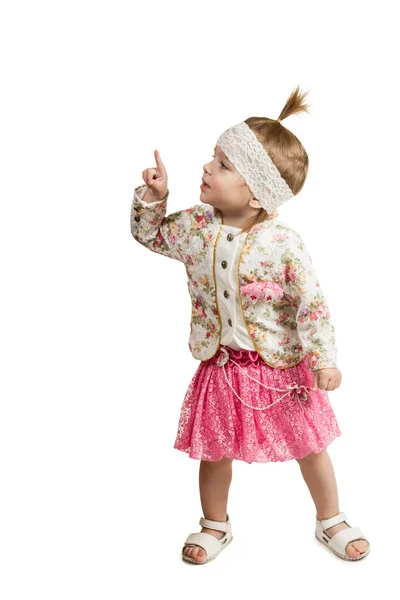 Young girl looking and pointing up at corner — Stock Photo, Image