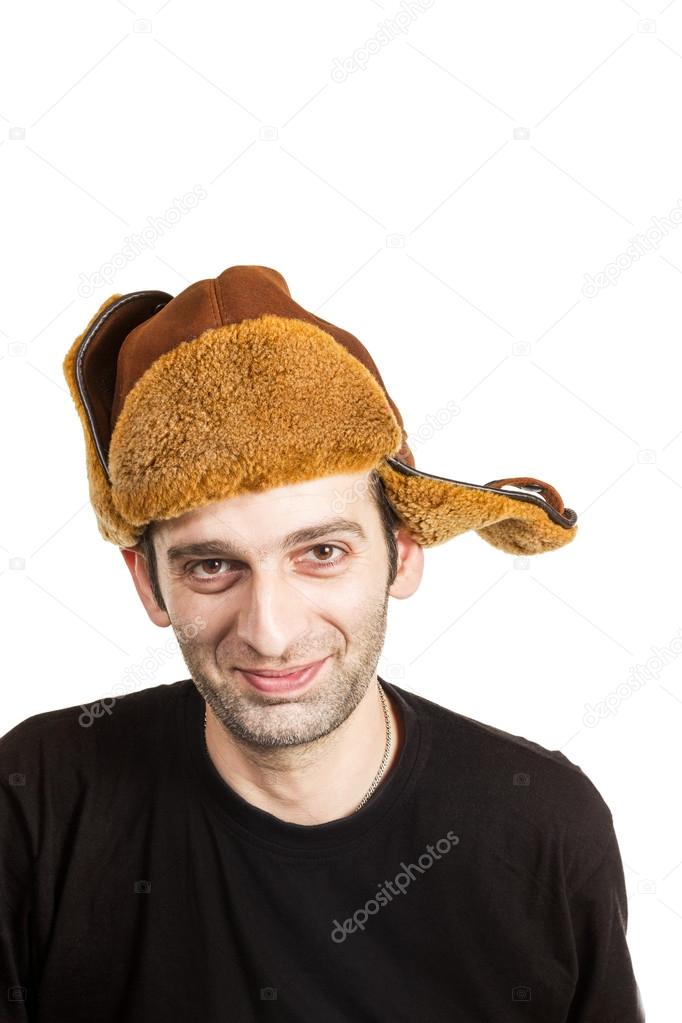 Young bearded man in the earflaps hat